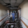 Palestinian hospital staff inspect the destruction inside Nasser hospital in Khan Yunis in the southern Gaza Strip, following an Israeli strike early on May 13, 2025 in which Palestinian journalist Hassan Aslih was killed along with several others.