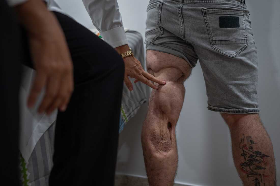 Dr. Galit Sivak (left) performs an examination with her patient Nevo. 
