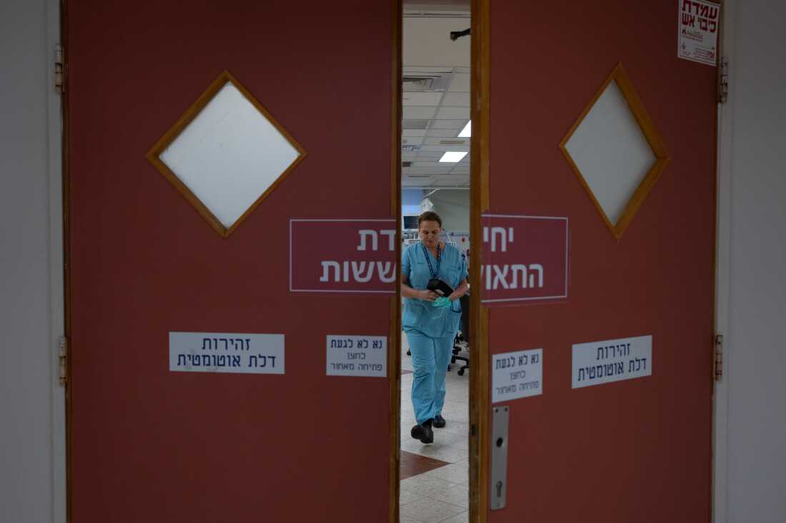 Dr. Galit Sivak (center), head of the vascular surgery department, walks through Rabin Medical Center.