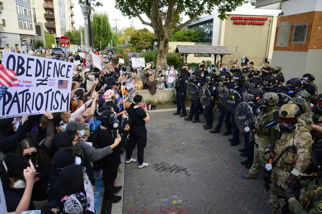 Federal agents confront protesters outside of the U.S. Immigration and Customs Enforcement building on September 28, 2025 in Portland, Oregon.