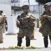 Members of the California National Guard and U.S. Marines guard a federal building in June.