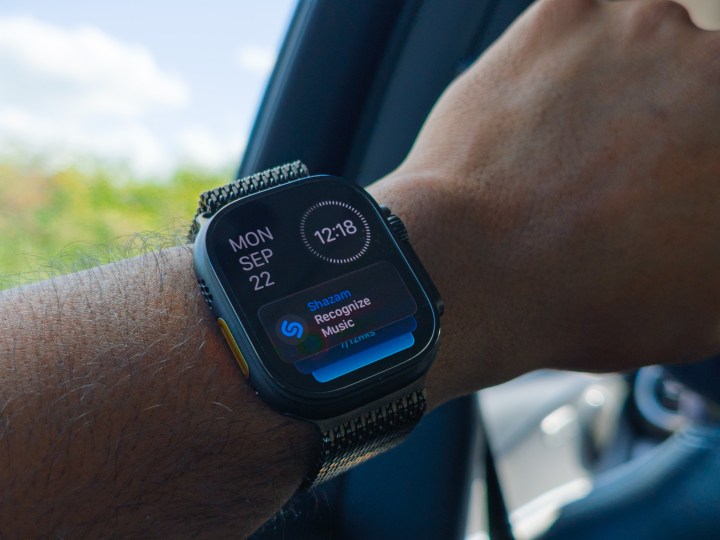 Apple Watch Ultra 3 in black titanium on a hand