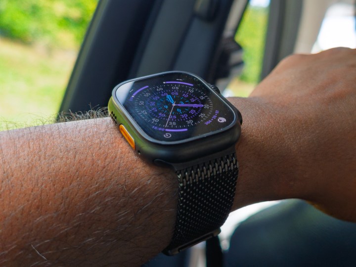 Apple Watch Ultra 3 in black titanium on a hand