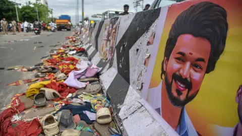 Ragul Krishan/EPA/Shutterstock A colourful portrait of actor-politician seen at a road intersection near the site of the crush that killed at least 40 people in southern India.

Mandatory Credit: Photo by RAGUL KRISHNAN/EPA/Shutterstock (15507891x)
The scene of a deadly stampede accident in Karur, Tamil Nadu, India, 28 September 2025. At least 39 people died in a stampede that occurred on 27 September during a campaign event by Tamilaga Vettri Kazhagam (TVK) party leader Vijay, the health minister of Tamil Nadu said.
Dozens killed in stampede at political rally in India, Karur - 28 Sep 2025