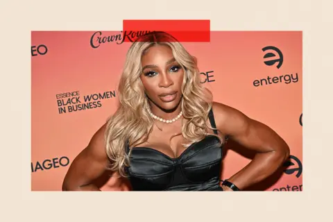 Getty Images for ESSENCE Serena Williams looking serious with her hands on her hips
