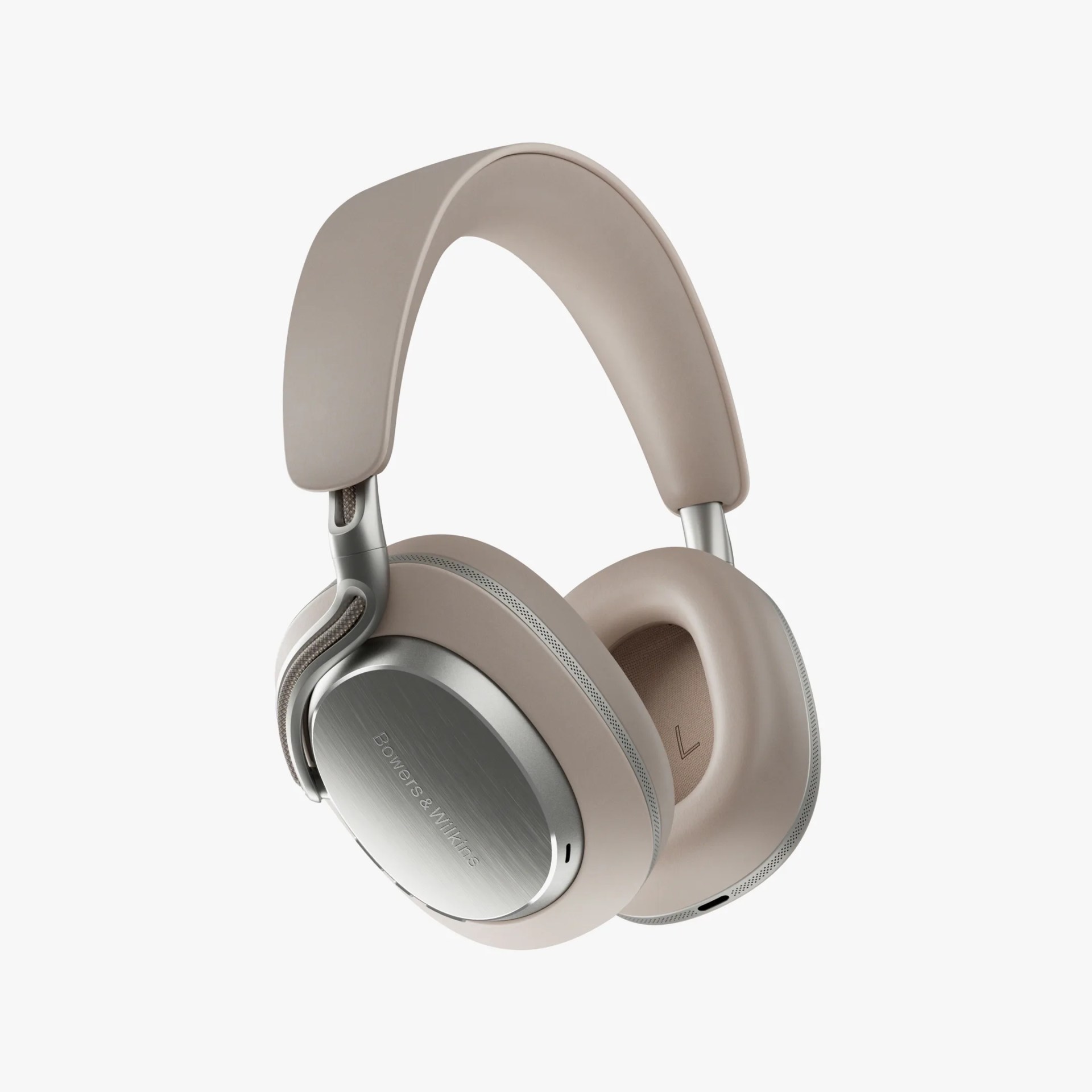 Over-ear headphones with a sleek, modern design featuring beige cushioned ear cups and headband. The outer ear cups have a brushed silver finish with the brand name 