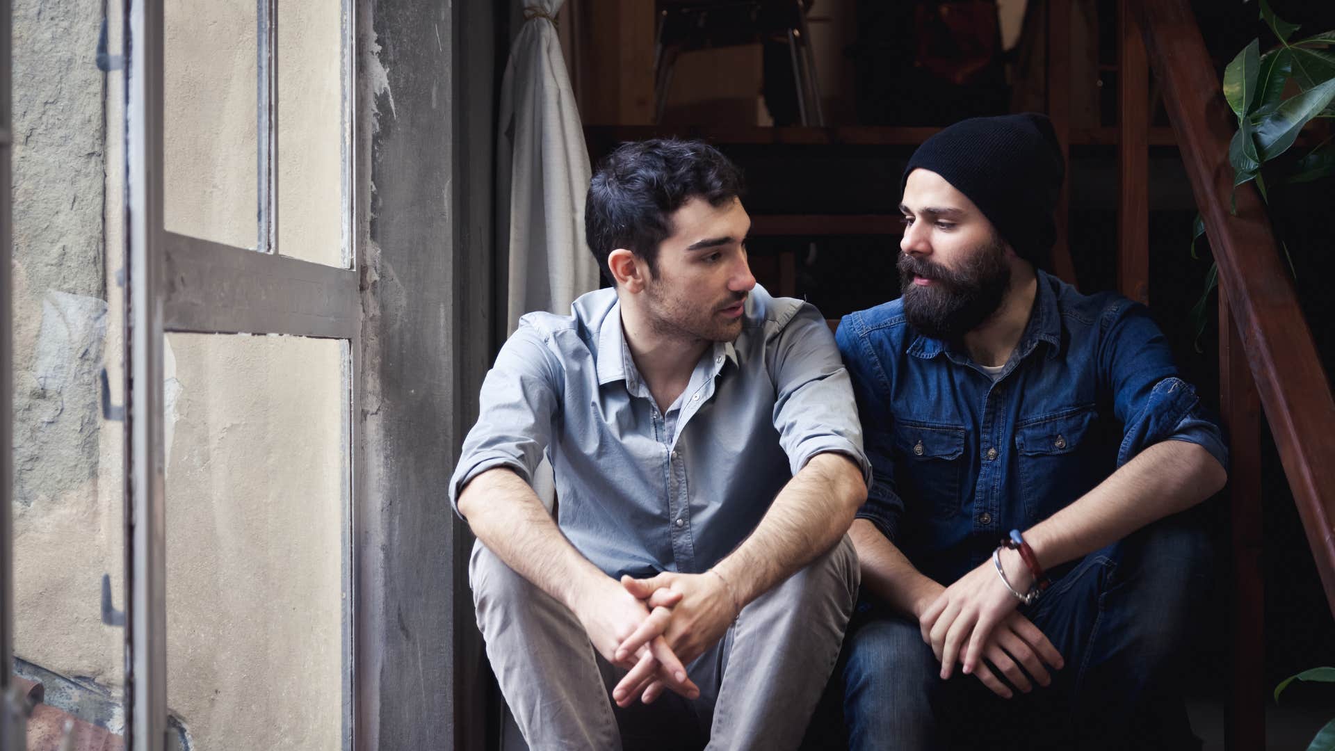 man telling friend he's fine but secretly struggling